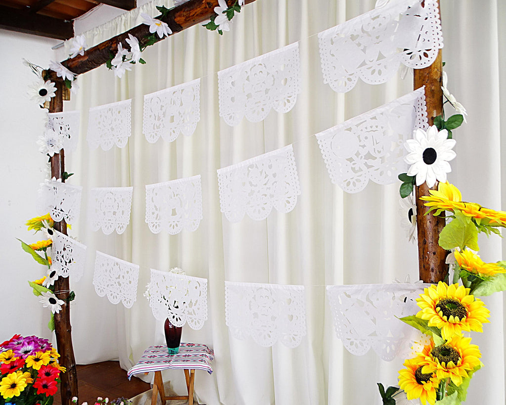background decorated with papel picado, baptism banner girl and boy,   hanging flag decorations, fiesta decor, 