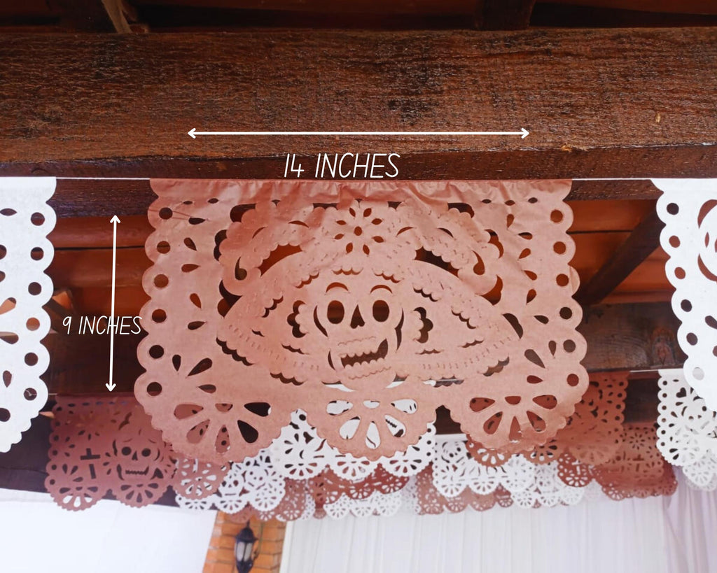 Decorative paper cutouts of sugar skulls for Day of the Dead