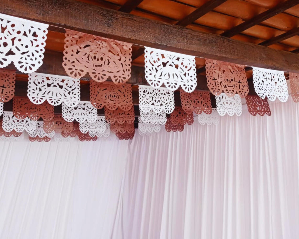 Decorative lace banner hanging against a wooden ceiling