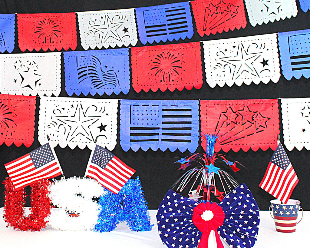 4th of july papel picado, star designs on each flag, red, blue and white paper decorations. 4th of july decor