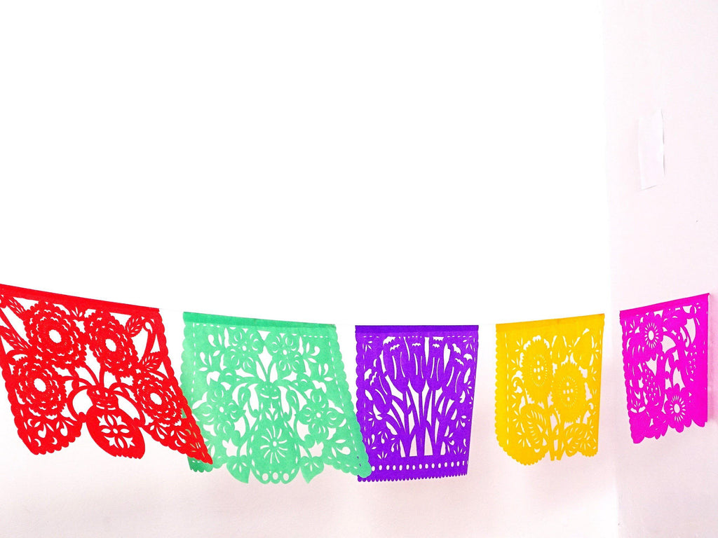 Multicolored confetti, red, green, purple, yellow, pink papel picado, decorations for cinco de mayo parties.