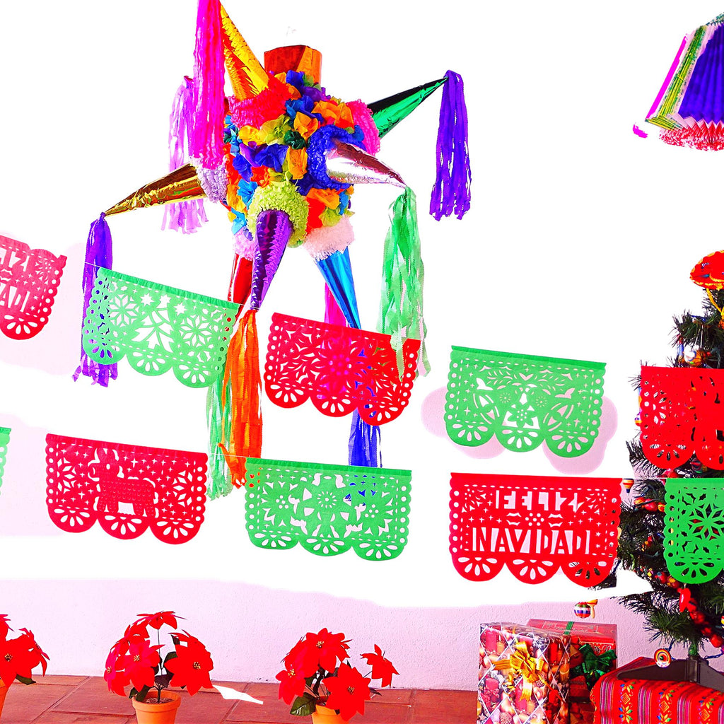 tissue paper banner in green and red with the words feliz Navidad cut outs